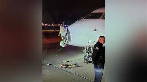 A taxiing airplane collides with a Chicago airport shuttle, injuring 2 people